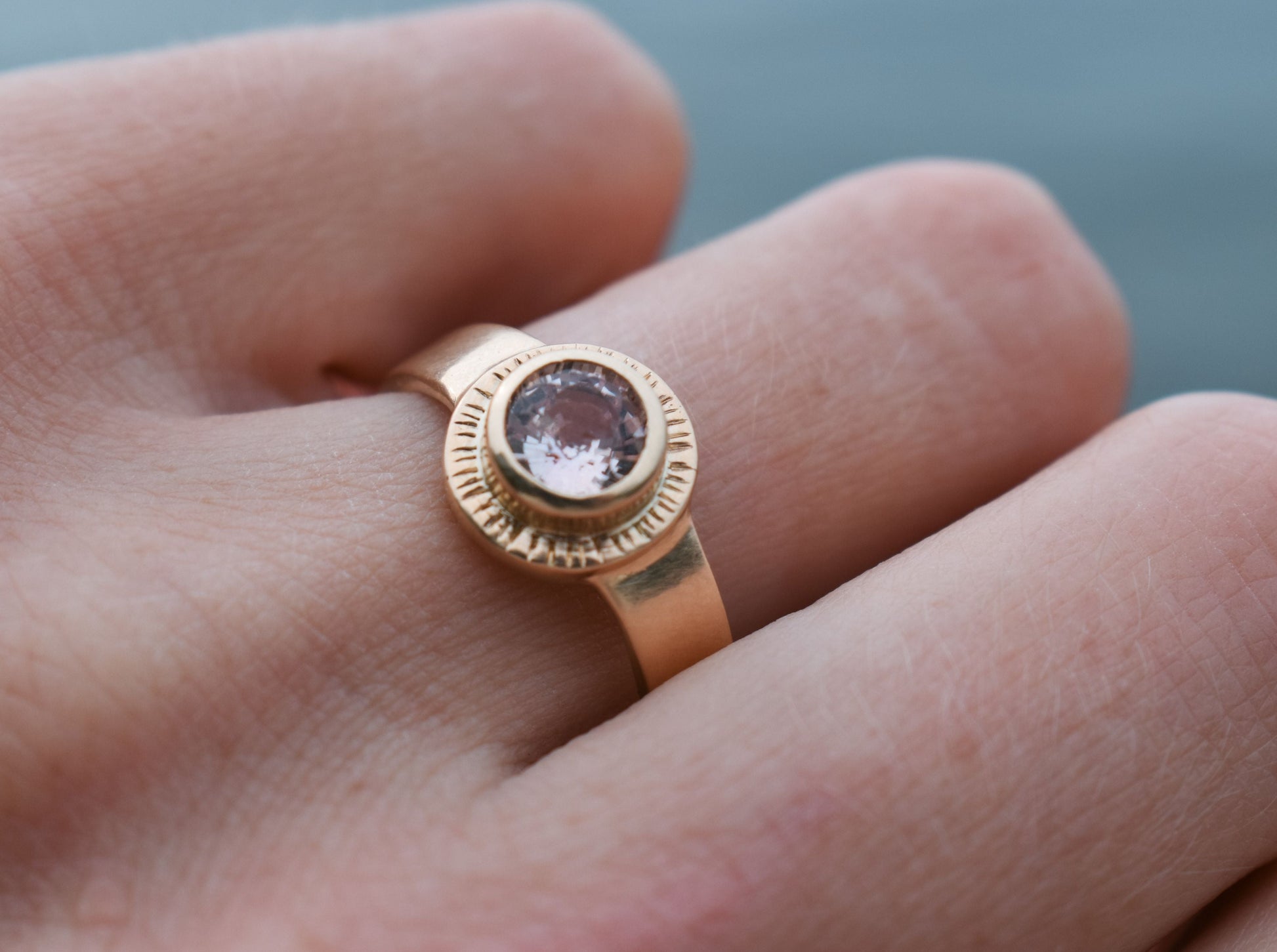 Sol Ring, pink sapphire solitaire, padparadscha sapphire ring, sun ring, celestial ring, ethical jewelry, ethical bridal jewelry, sustainably sourced known origin, recycled gold, nature, inspired jewelry, ethical sapphires, natural sapphires